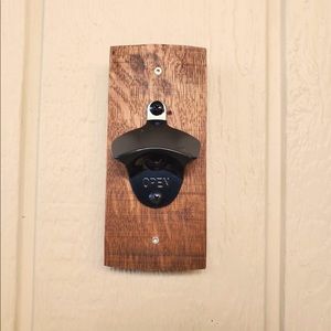 Wine barrel bottle opener